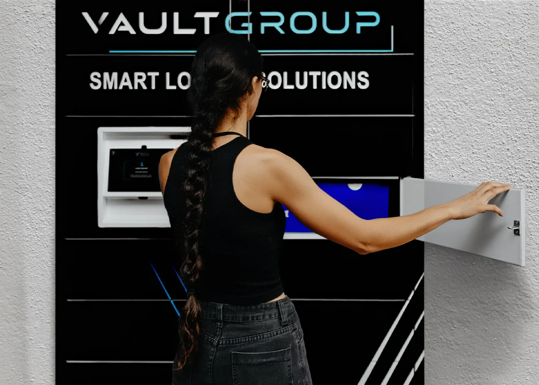 A customer using a VaultGroup PackVault screen to collect a parcel
