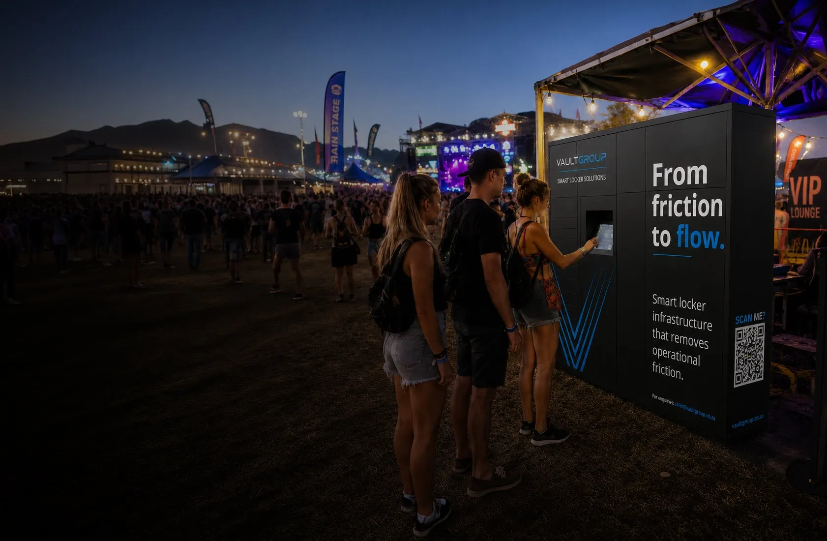 Visitors using a VaultGroup smart locker at a night-time outdoor event