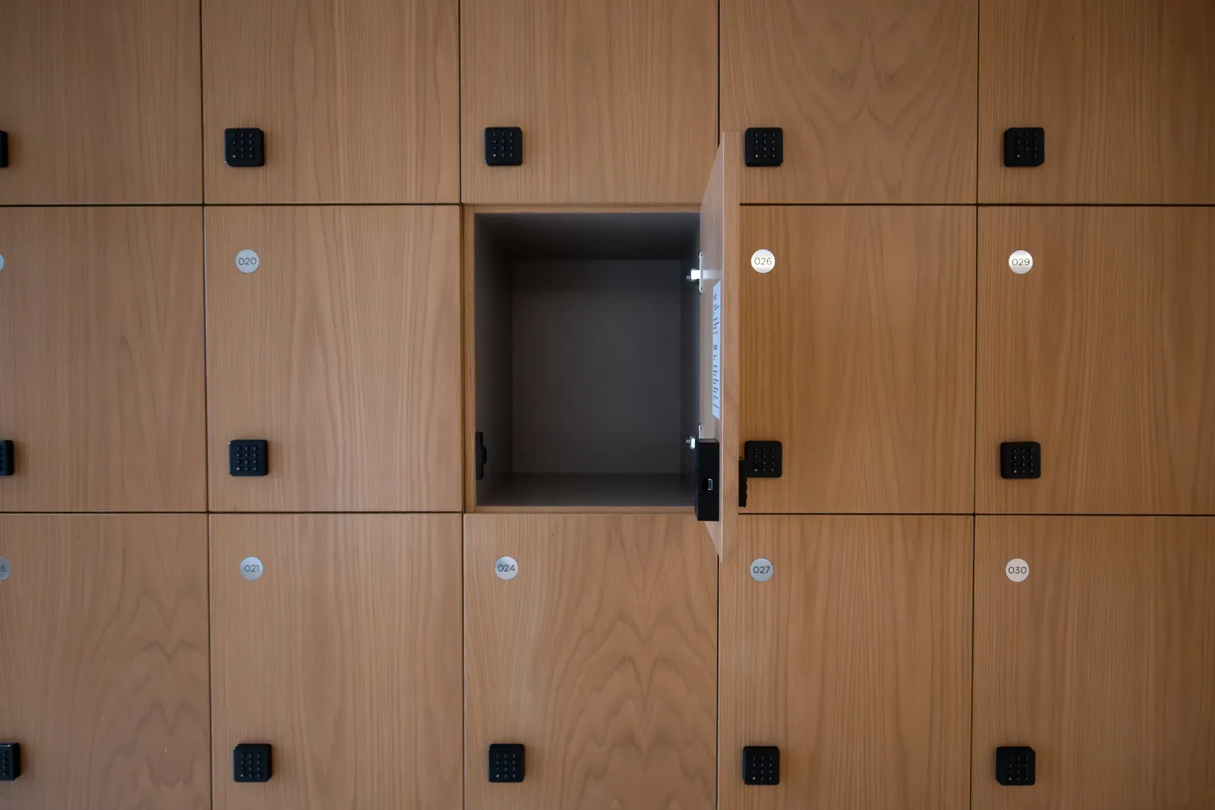 Timber change-room lockers fitted with VG SmartLock keypads, one door standing open