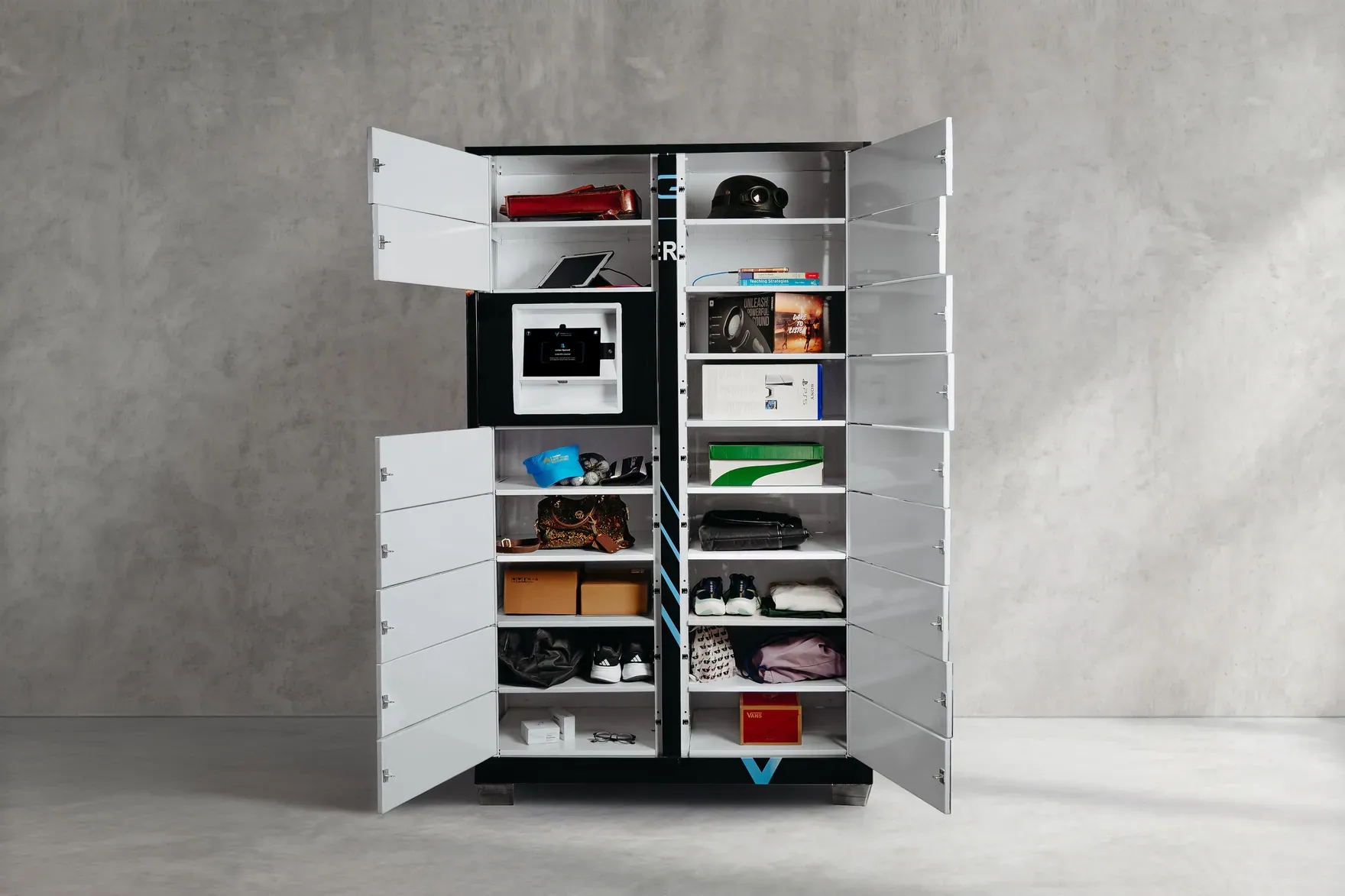 An open PackVault smart locker holding shoes, bags and parcels
