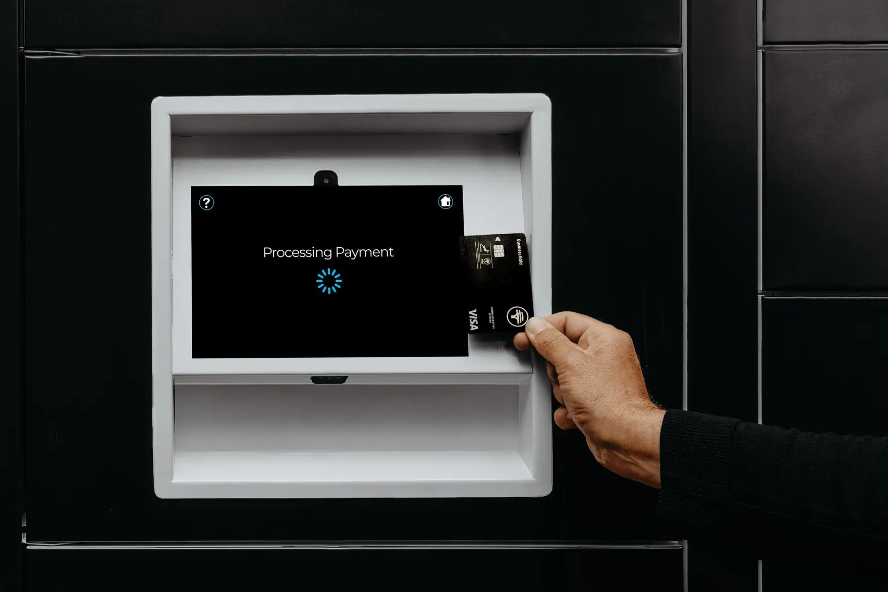 A customer tapping a card on a PackVault payment screen reading Processing Payment