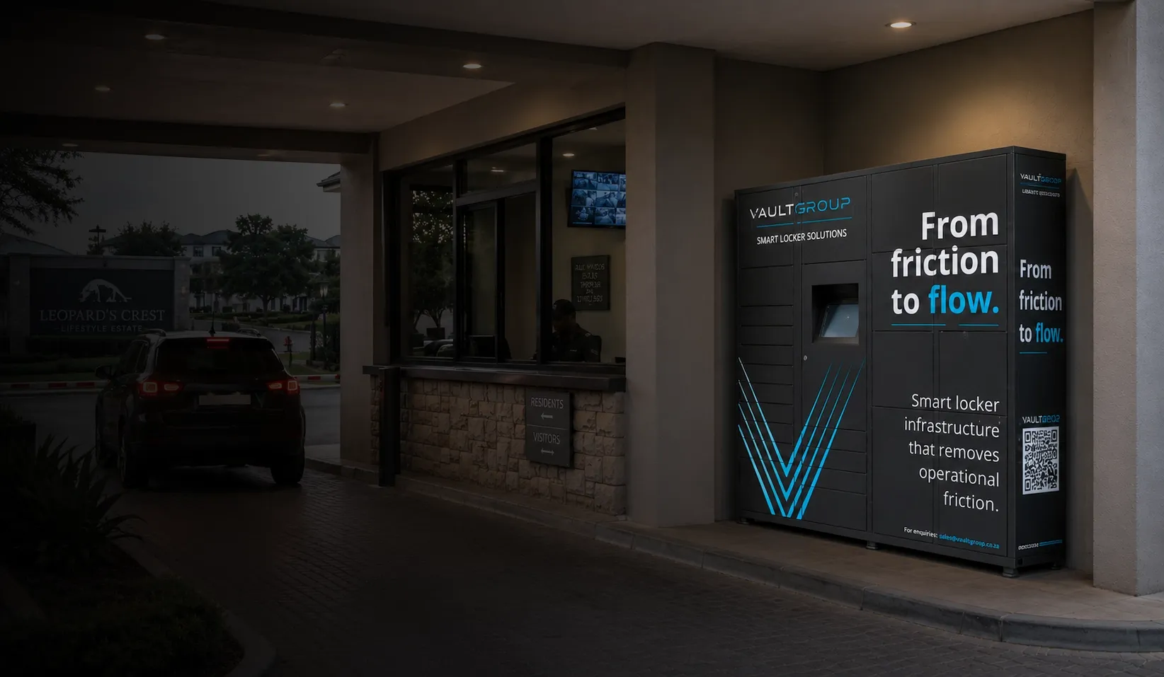A VaultGroup smart locker at the entrance of a residential estate at dusk